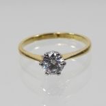 An 18 carat gold solitaire ring, the single stone approximately 0.