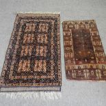A Persian rug, with two rows of medallions, on a dark ground, 150 x 85cm,