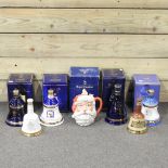 A collection of Bell's commemorative whisky decanters, together with a Royal Doulton toby jug,