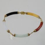 A 14 carat gold and jade coloured hardstone bracelet