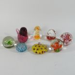 A collection of glass paper weights (8)