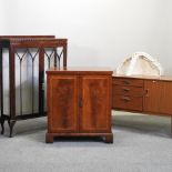 A 1970's sideboard, 153cm, together with a walnut cabinet, an Edwardian mahogany display cabinet,