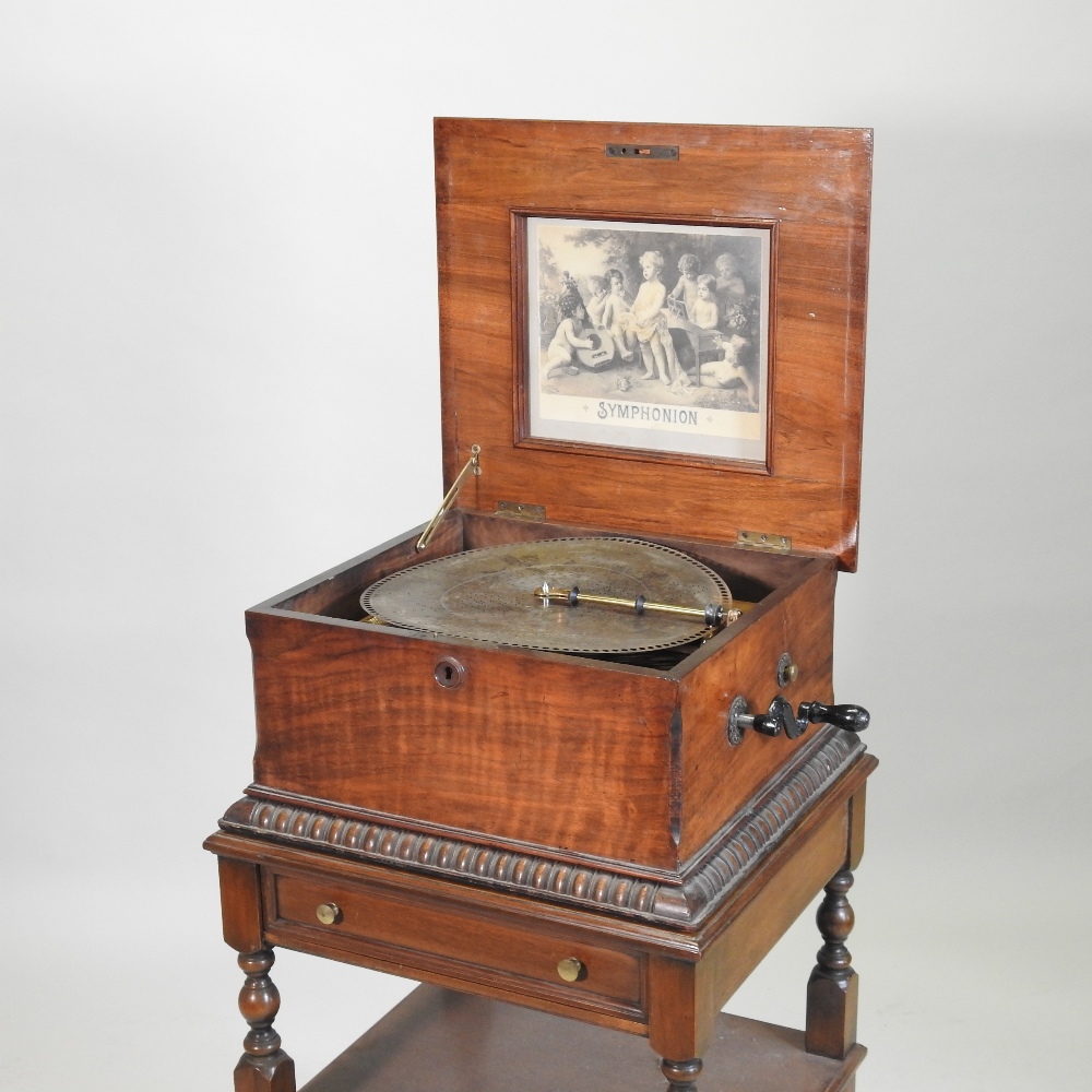 A 19th century German walnut cased wind up symphonion, the painted hinged lid, with a glass inset, - Image 7 of 17