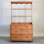 An antique pine chest, with a later pine plate rack,