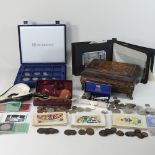 A collection of coins, photographs, postcards and other items,