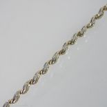 A 10 carat gold diamond link bracelet, approximately 1.