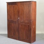 An antique pitch pine hall cupboard,