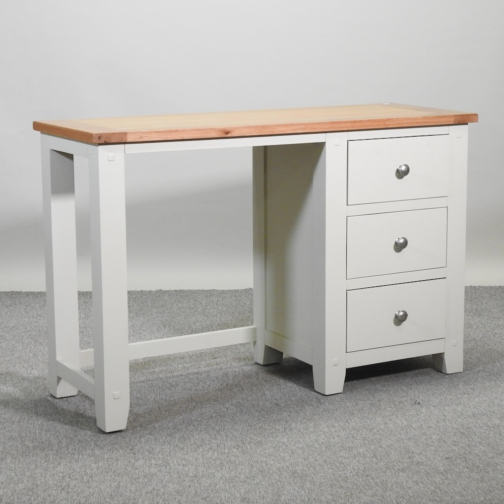 A modern light oak and cream painted desk,