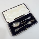 A silver Christening set, cased,