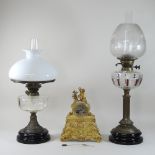 A Victorian brass oil lamp, with an etched glass shade, together with another,