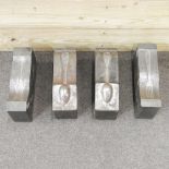 A set of four cast iron cutlery moulds