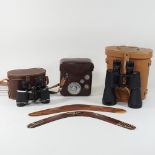 A pair of binoculars, together with another,