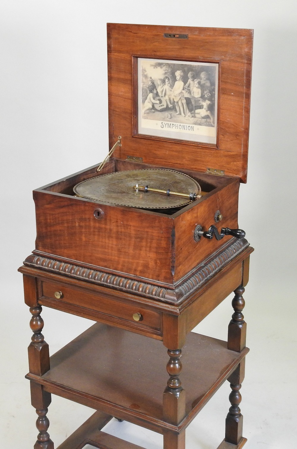 A 19th century German walnut cased wind up symphonion, the painted hinged lid, with a glass inset, - Image 8 of 17