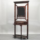 An Edwardian mahogany hall stand, with an inset mirror,