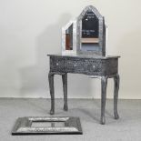 An embossed metal dressing table, 88cm, together with a matching dressing mirror,