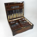 An oak cased canteen of silver plated cutlery,