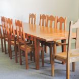 A light oak dining table, with two additional leaves, 280 x 90cm overall,