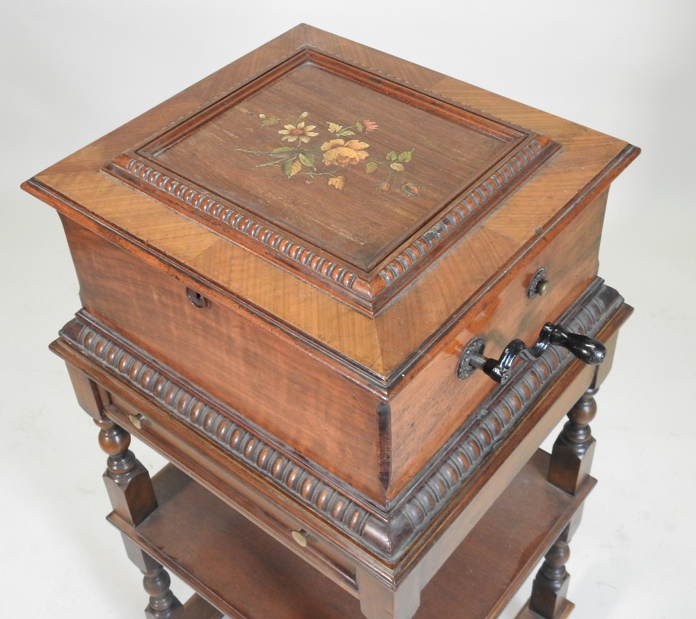 A 19th century German walnut cased wind up symphonion, the painted hinged lid, with a glass inset, - Image 12 of 17