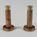 A pair of early 20th century Trench Art copper table candlesticks,