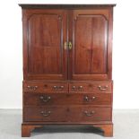 A George III mahogany dwarf linen press, fitted inside, on bracket feet,