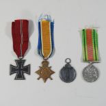 A World War II German cross medal, together with a World War II defence medal, a World War I star,