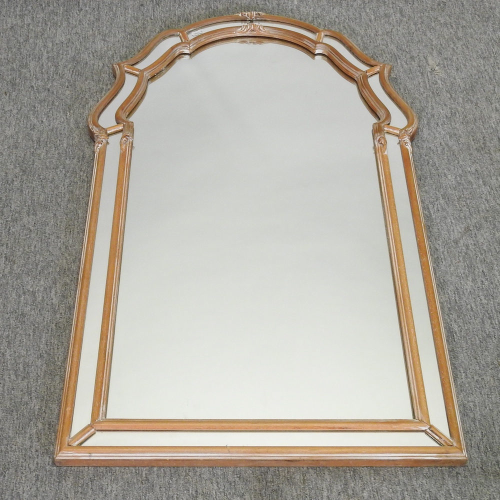 A modern shaped wall mirror,