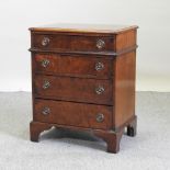 A Regency style walnut and crossbanded bachelor's chest,