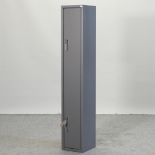 A metal gun cabinet, with keys,