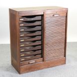 An early 20th century oak double tambour fronted filing cabinet,