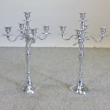 A pair of plated table candelabra,