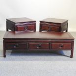 A pair of Chinese hardwood side tables together with a matching coffee table,