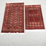 A Bokhara rug, with two rows of medallions, on a red ground, 174 x 94cm,