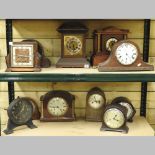 A collection of various clocks and clock parts