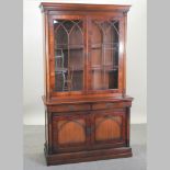 An oak and yew wood cabinet bookcase,