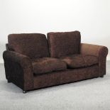 A modern brown upholstered sofa,