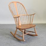 An Ercol light elm rocking chair