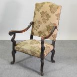 A Victorian tan upholstered high back open armchair,