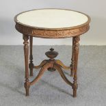 A Victorian gilt occasional table, with a white painted top,