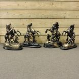 A collection of four spelter models of Marley horses,