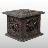 An 18th century carved oak carriage warmer, with carved openwork decoration and hinged lid,
