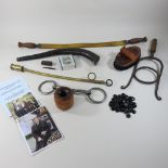 A collection of vintage equestrian items, to include a horse drenching horn, brass balling gun,