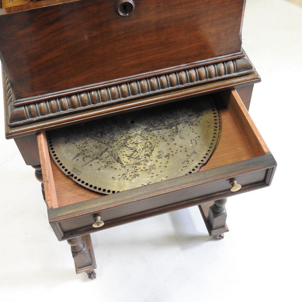 A 19th century German walnut cased wind up symphonion, the painted hinged lid, with a glass inset, - Image 9 of 17