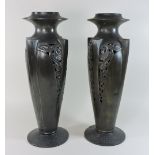 A pair of Geschutzt Art Deco pewter vases, of slender tapered shape,