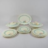 A collection of Clarice Cliff Crocus pattern dinner wares, comprising a pair of tureens and covers,