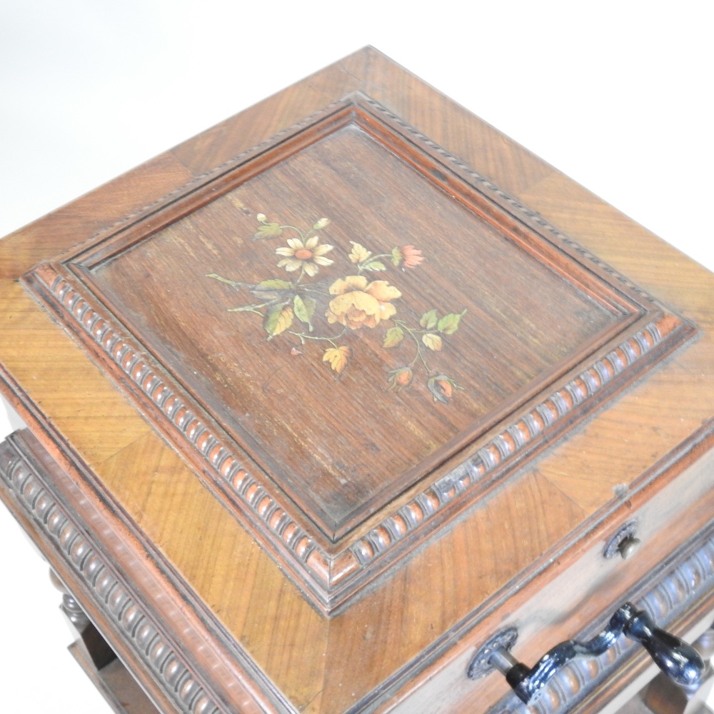 A 19th century German walnut cased wind up symphonion, the painted hinged lid, with a glass inset, - Image 11 of 17