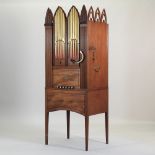 A 19th century carved mahogany cased barrel organ, of Gothic revival style,