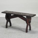 A carved oak bench, 'Cheshire', inscribed July 1940 C.