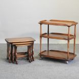 An Ercol nest of three occasional tables, together with an Ercol drinks trolley,