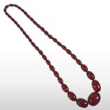 A cherry amber bead necklace,