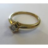 A 9ct gold and diamond single stone ring